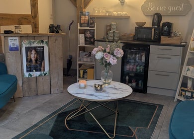 Inviting lounge area at The Beauty Barn at Pinwall, Atherstone, England, GB, featuring elegant decor and seating.
