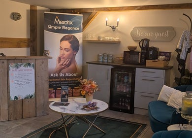 Welcoming reception at The Beauty Barn at Pinwall, Atherstone, England, GB, featuring skincare banner and refreshments.