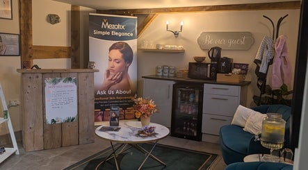 Welcoming reception at The Beauty Barn at Pinwall, Atherstone, England, GB, featuring skincare banner and refreshments.