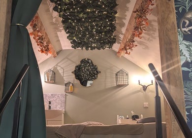 Chic, tranquil room at The Beauty Barn at Pinwall, Atherstone, England, GB with leafy decor and ambient lighting.