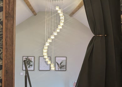 Chic interior with elegant lighting at The Beauty Barn at Pinwall, Atherstone, England, GB.