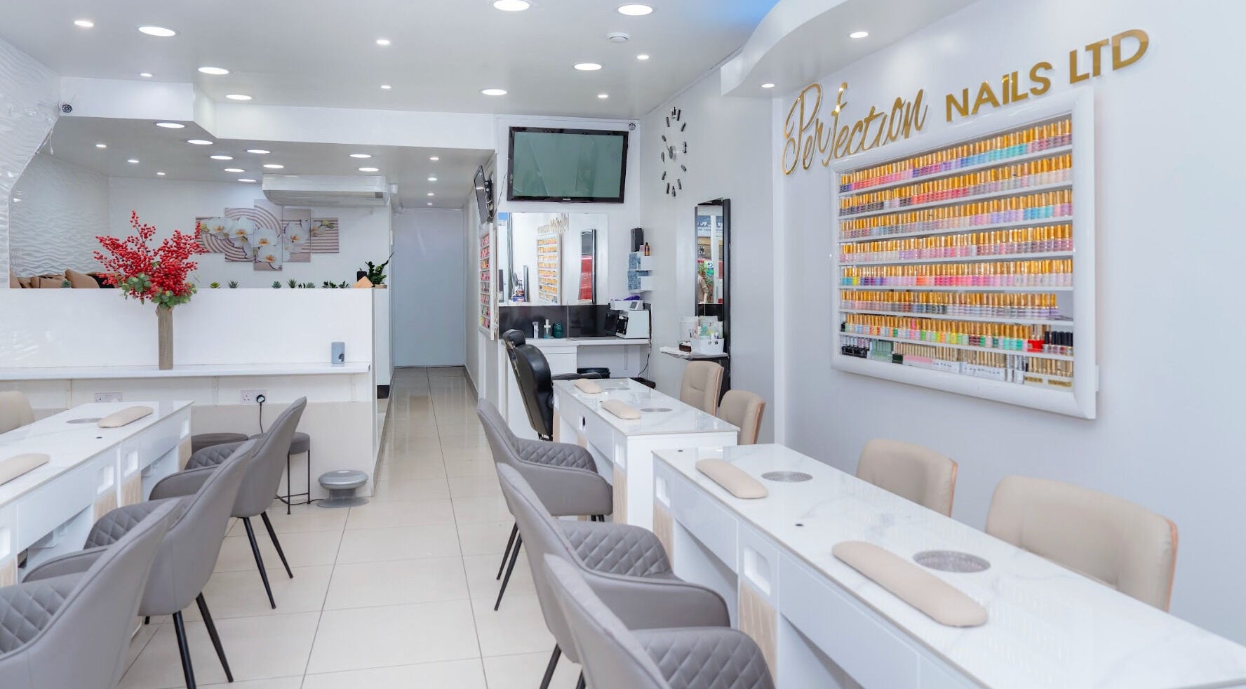 Bright interior of Perfection Nail in London, England, GB showcasing elegant nail stations and decor.