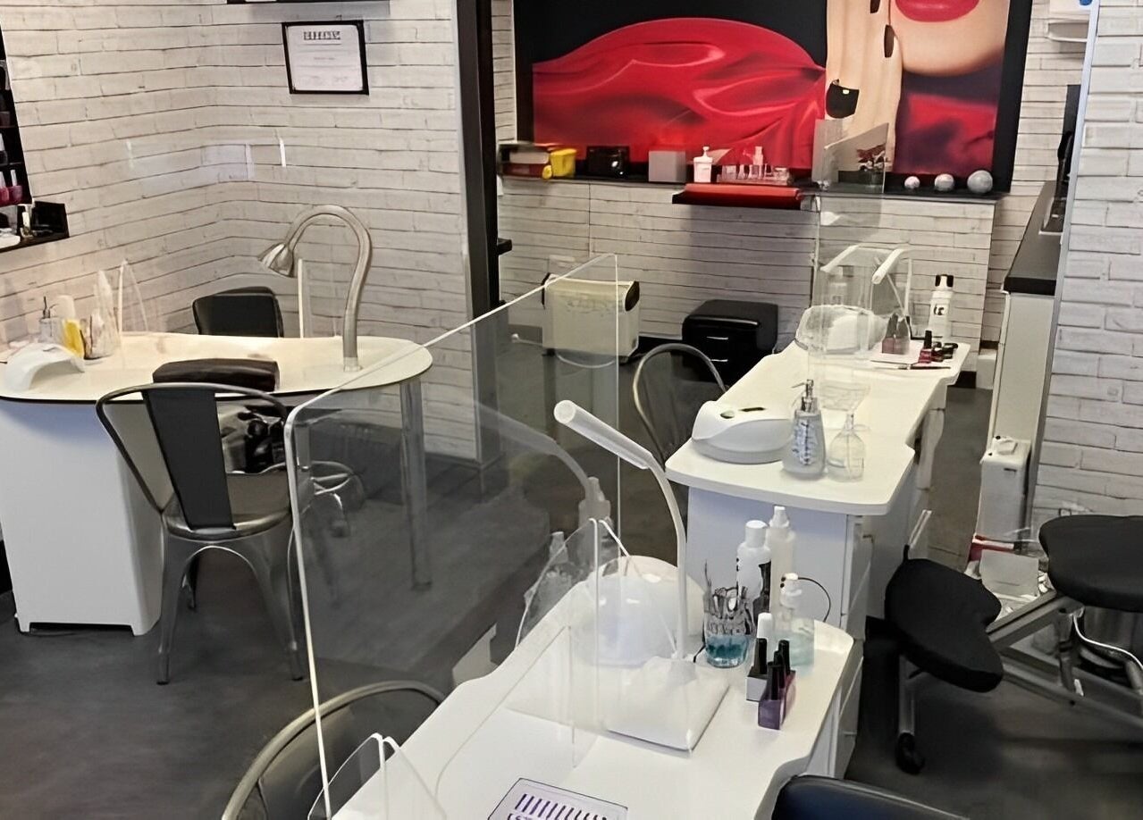 Chic nail stations at The Nail Studio, Stratford-upon-Avon, England, GB with modern decor and equipment.