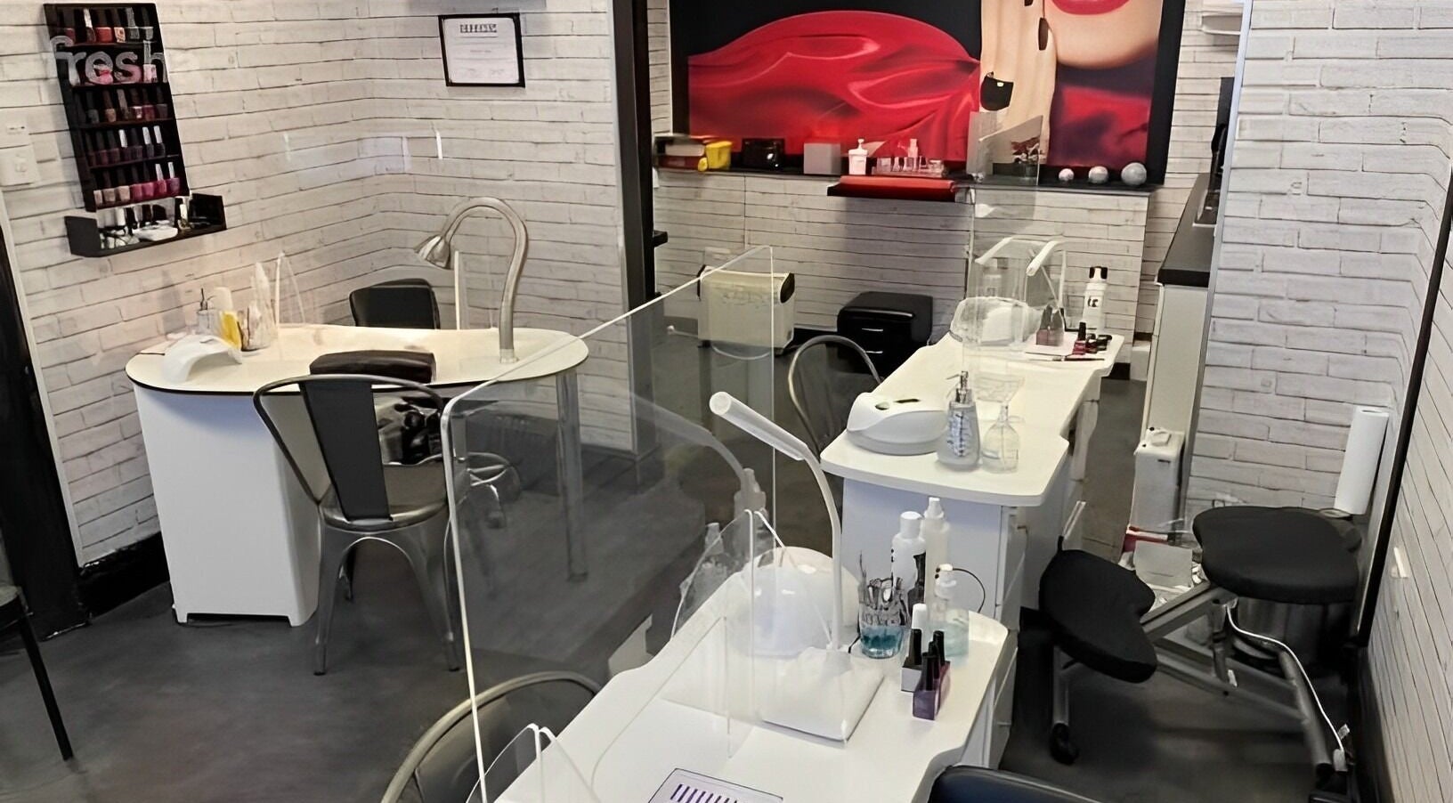 Chic nail stations at The Nail Studio, Stratford-upon-Avon, England, GB with modern decor and equipment.