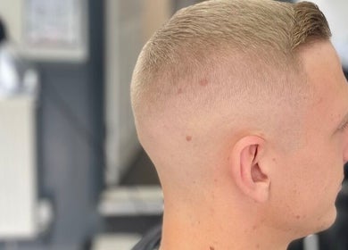 Close-up of a clean fade haircut at Allens Barbers & Co, Southampton, England, GB.