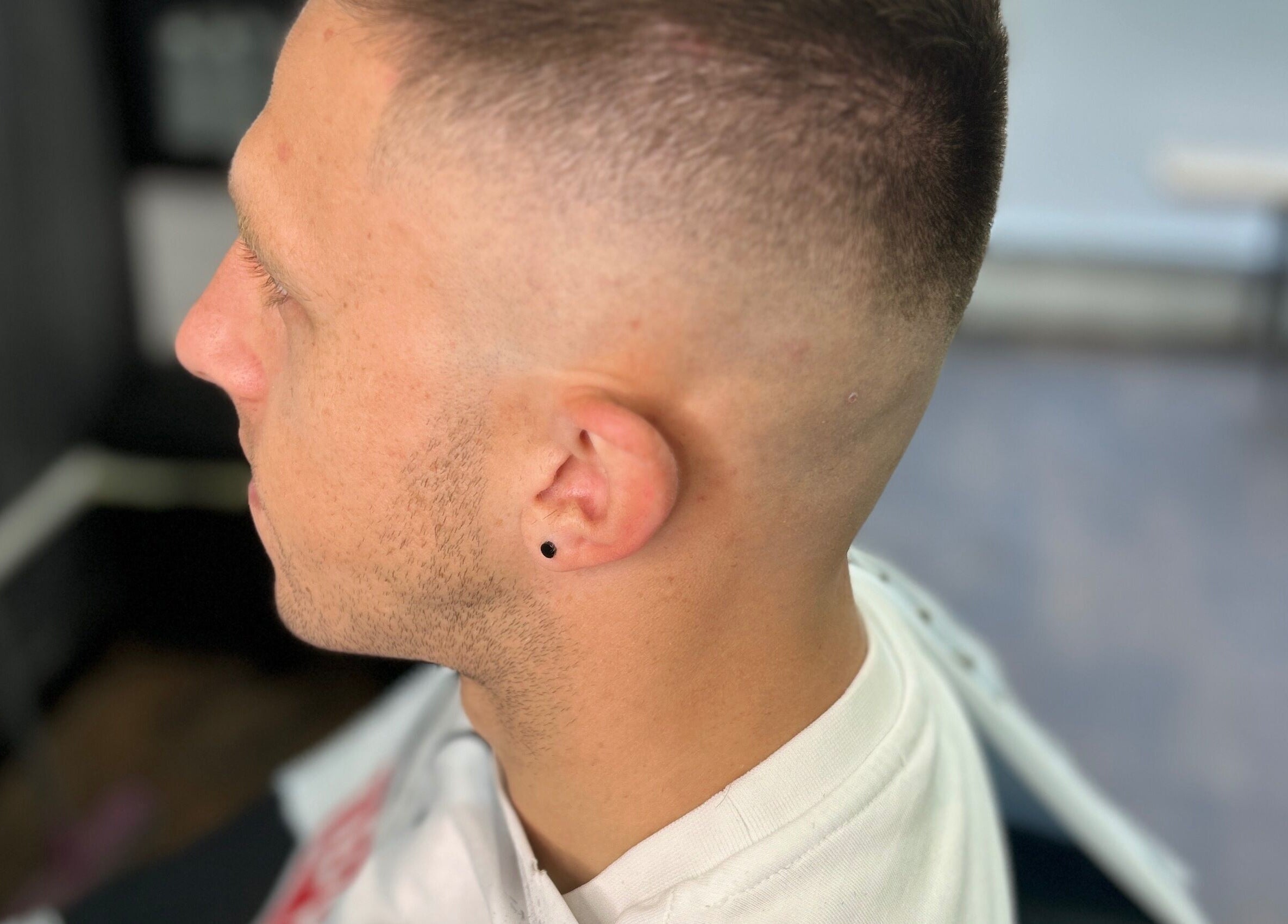Close-up of a fresh fade haircut at Allens Barbers & Co, Southampton, England, GB.