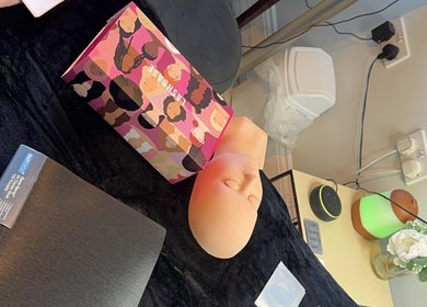 Beauty setup at Pretty By Hannah Giles, Banbury, England, GB with mannequin and vibrant box.