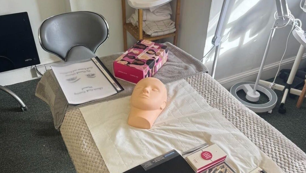 Training workspace at Pretty By Hannah Giles, Banbury, England, GB showcasing beauty mannequin and tools.