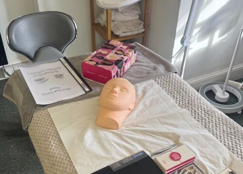 Training workspace at Pretty By Hannah Giles, Banbury, England, GB showcasing beauty mannequin and tools.