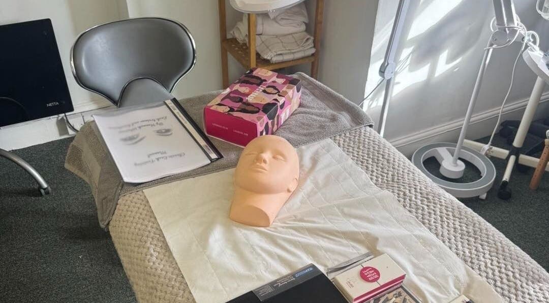 Training workspace at Pretty By Hannah Giles, Banbury, England, GB showcasing beauty mannequin and tools.