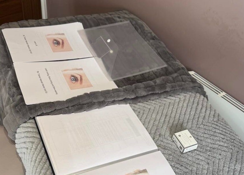 Beauty treatment setup at Pretty By Hannah Giles in Banbury, England, GB, featuring educational materials.