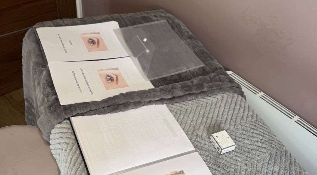 Beauty treatment setup at Pretty By Hannah Giles in Banbury, England, GB, featuring educational materials.