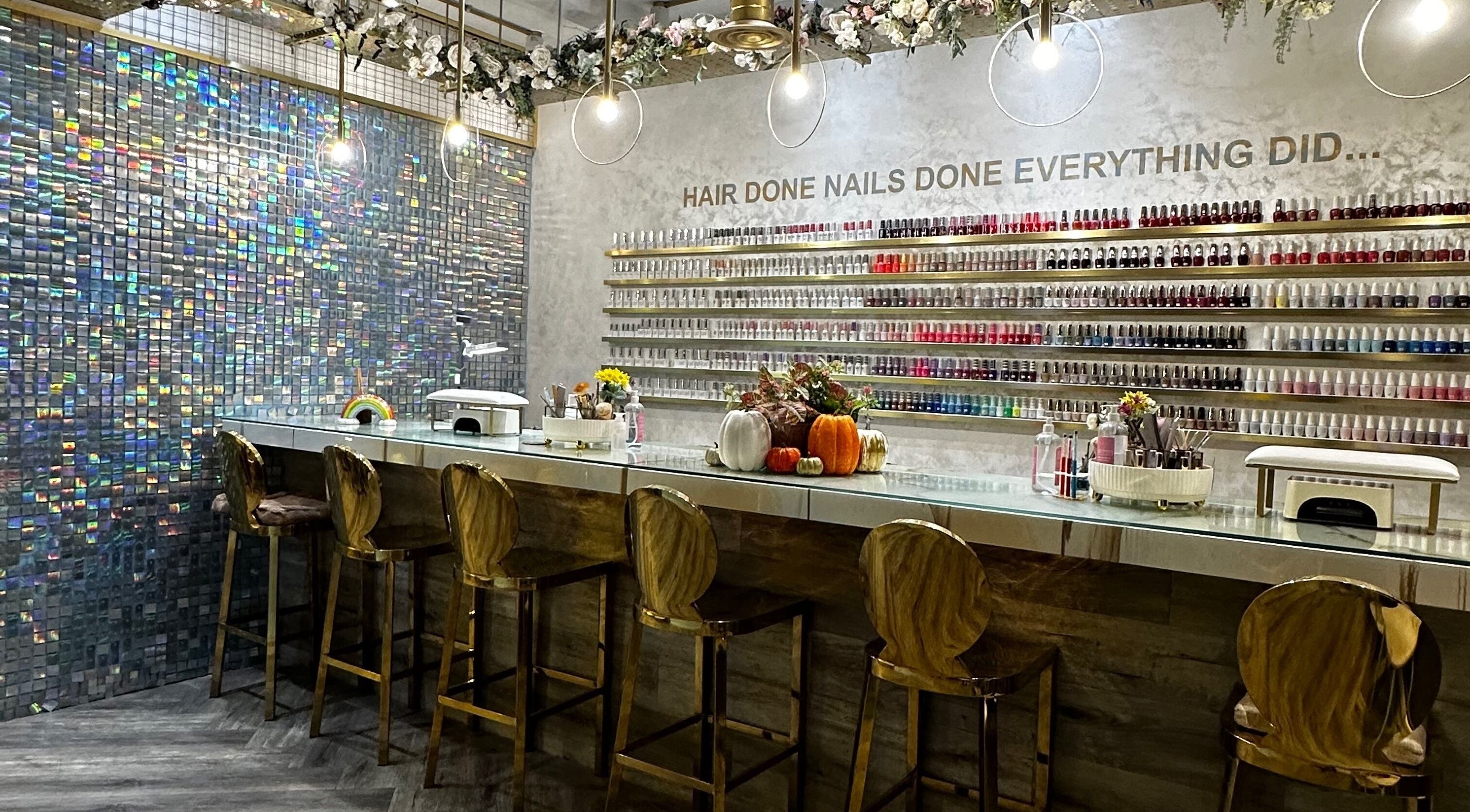 Elegant nail salon interior at Studio Ac, London, England, GB, featuring stylish seating and polish display.