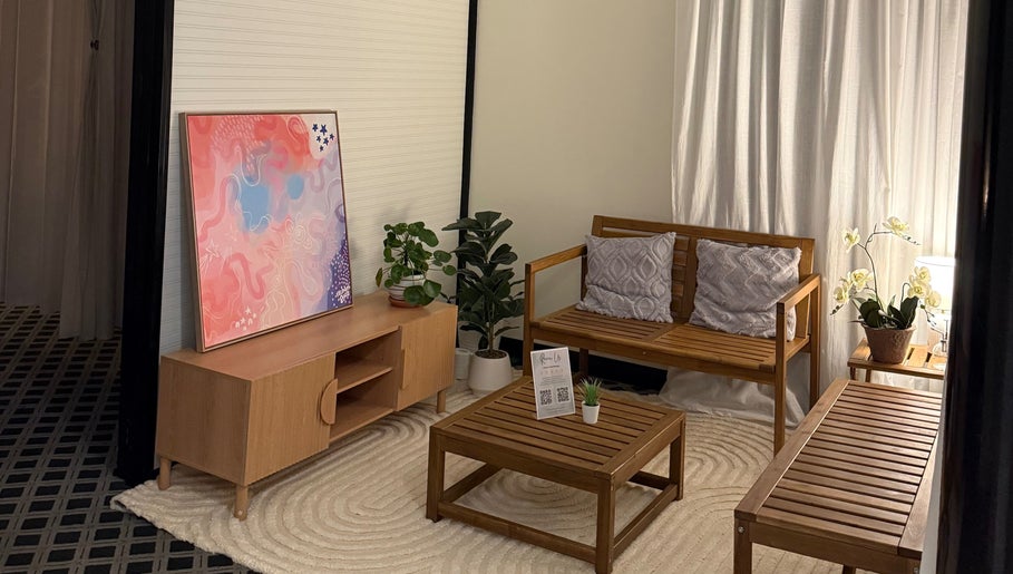 Cozy lounge at Thanwa Thai Massage with wooden furniture in Melbourne, Victoria, AU.