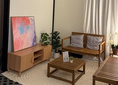 Cozy lounge at Thanwa Thai Massage with wooden furniture in Melbourne, Victoria, AU.
