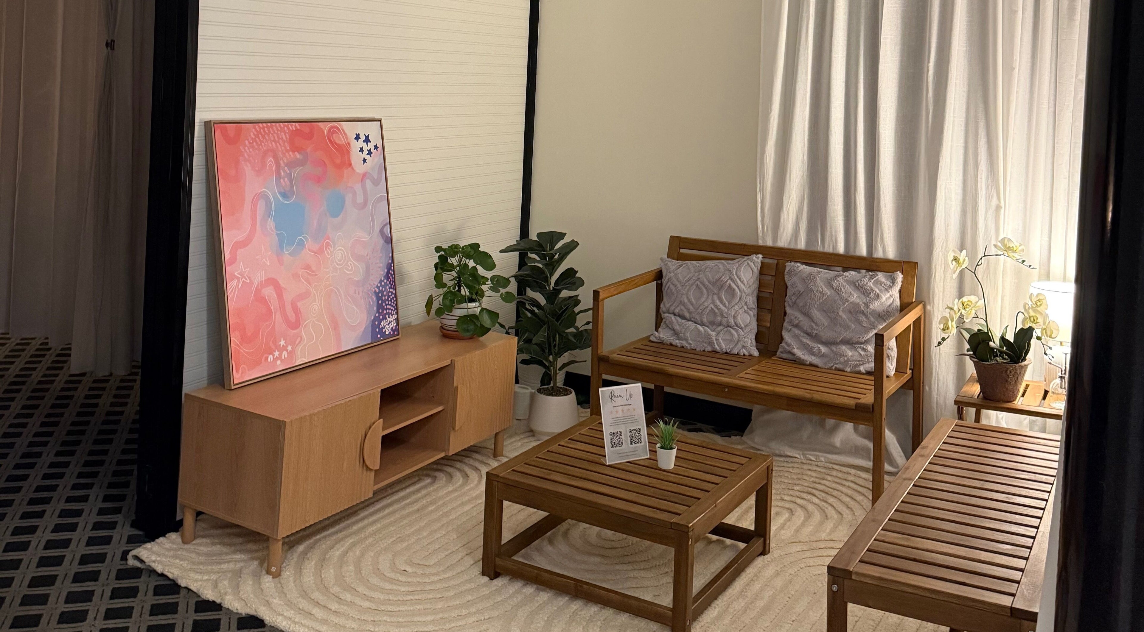 Cozy lounge at Thanwa Thai Massage with wooden furniture in Melbourne, Victoria, AU.