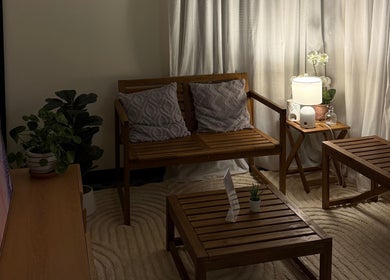 Cozy seating area inside Thanwa Thai Massage, Melbourne, Victoria, AU, with soft lighting and elegant decor.