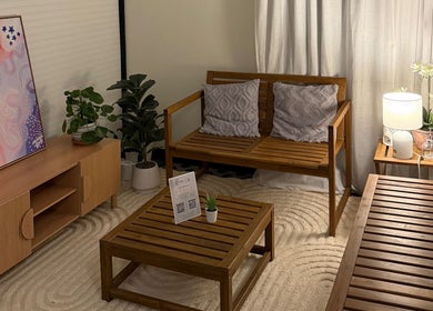 Tranquil seating area at Thanwa Thai Massage, Melbourne, Victoria, AU with wooden furniture and soothing decor.