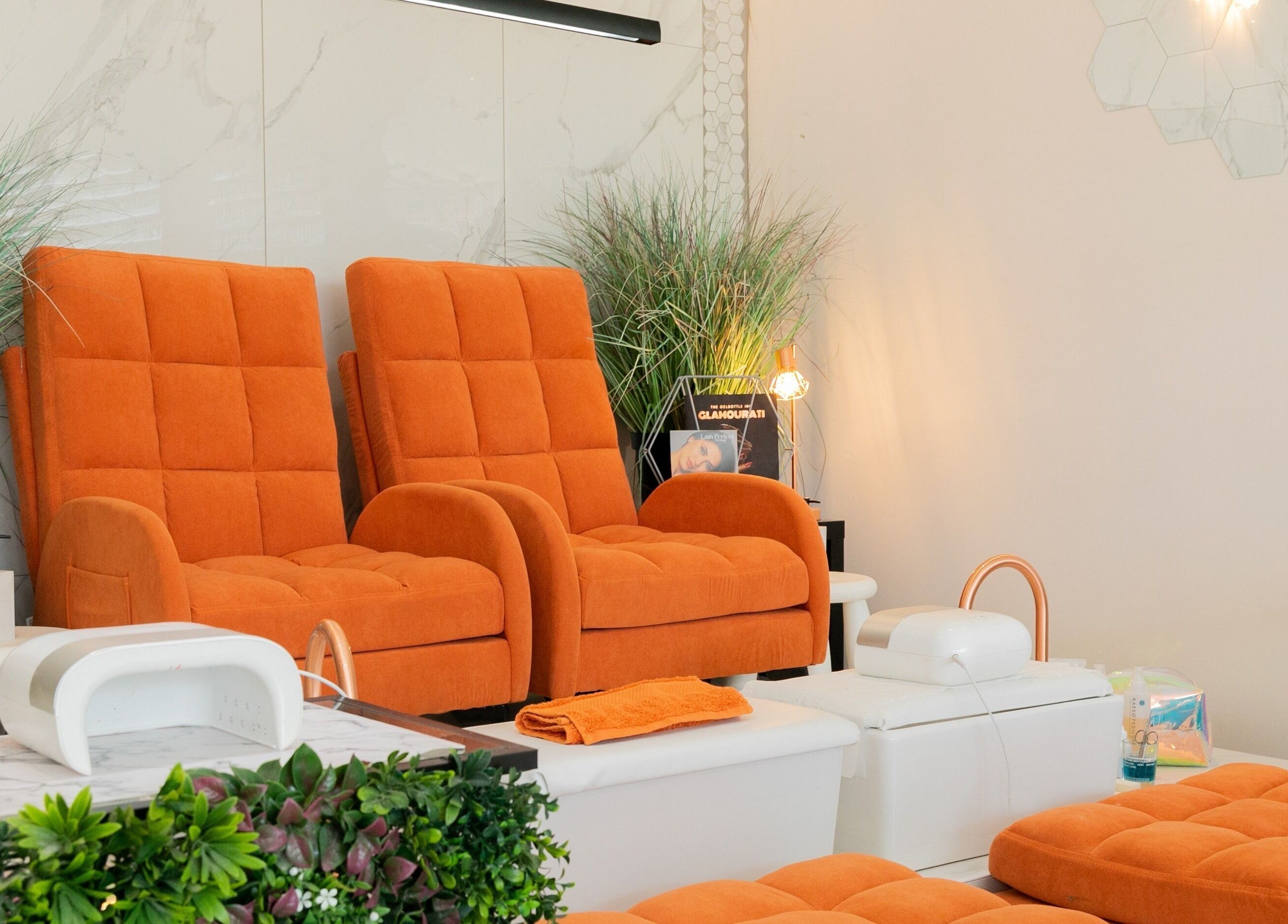 Modern orange chairs at Gorgeous, a luxurious spa in Wolverhampton, England, GB.