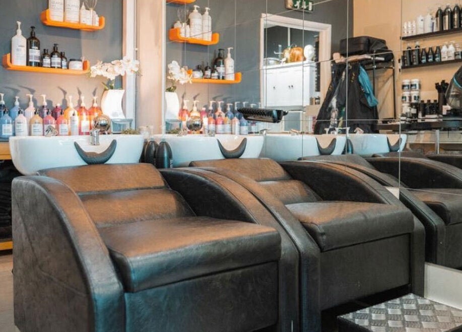 Stylish salon interior at Gorgeous in Wolverhampton, England, GB showcasing modern hair washing stations.