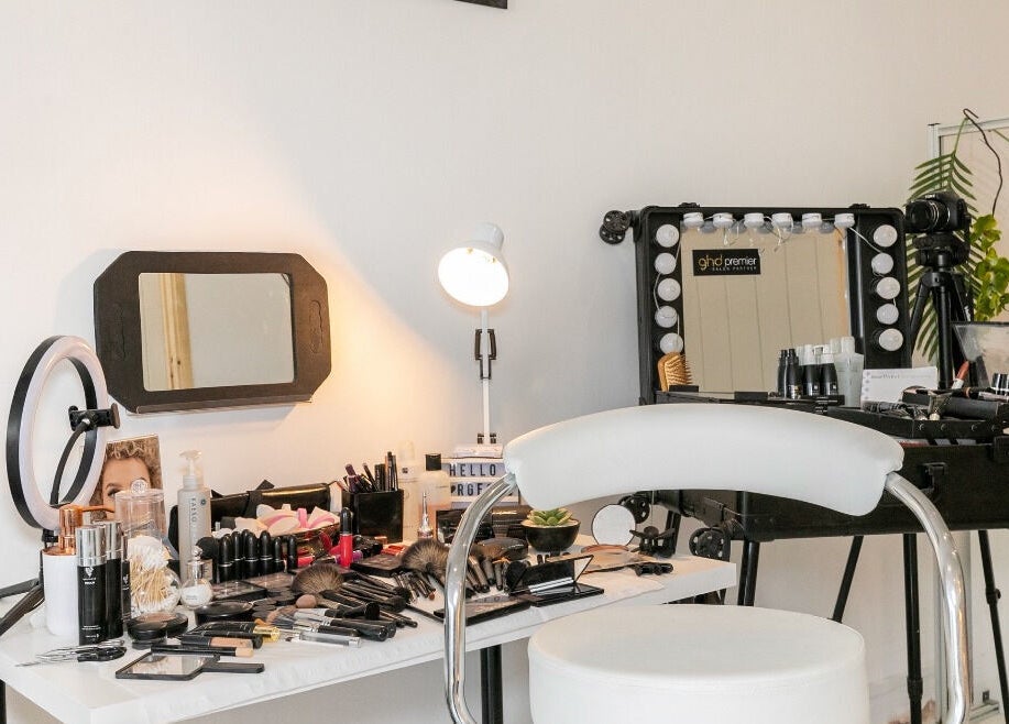 Makeup station at Gorgeous, Wolverhampton, England, GB with chair, mirrors, and cosmetics setup.