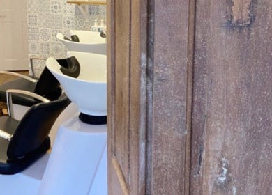 Wash stations at The Hairdresser at The Studio, 1 Vicarage Street, Frome, England, GB with elegant decor.