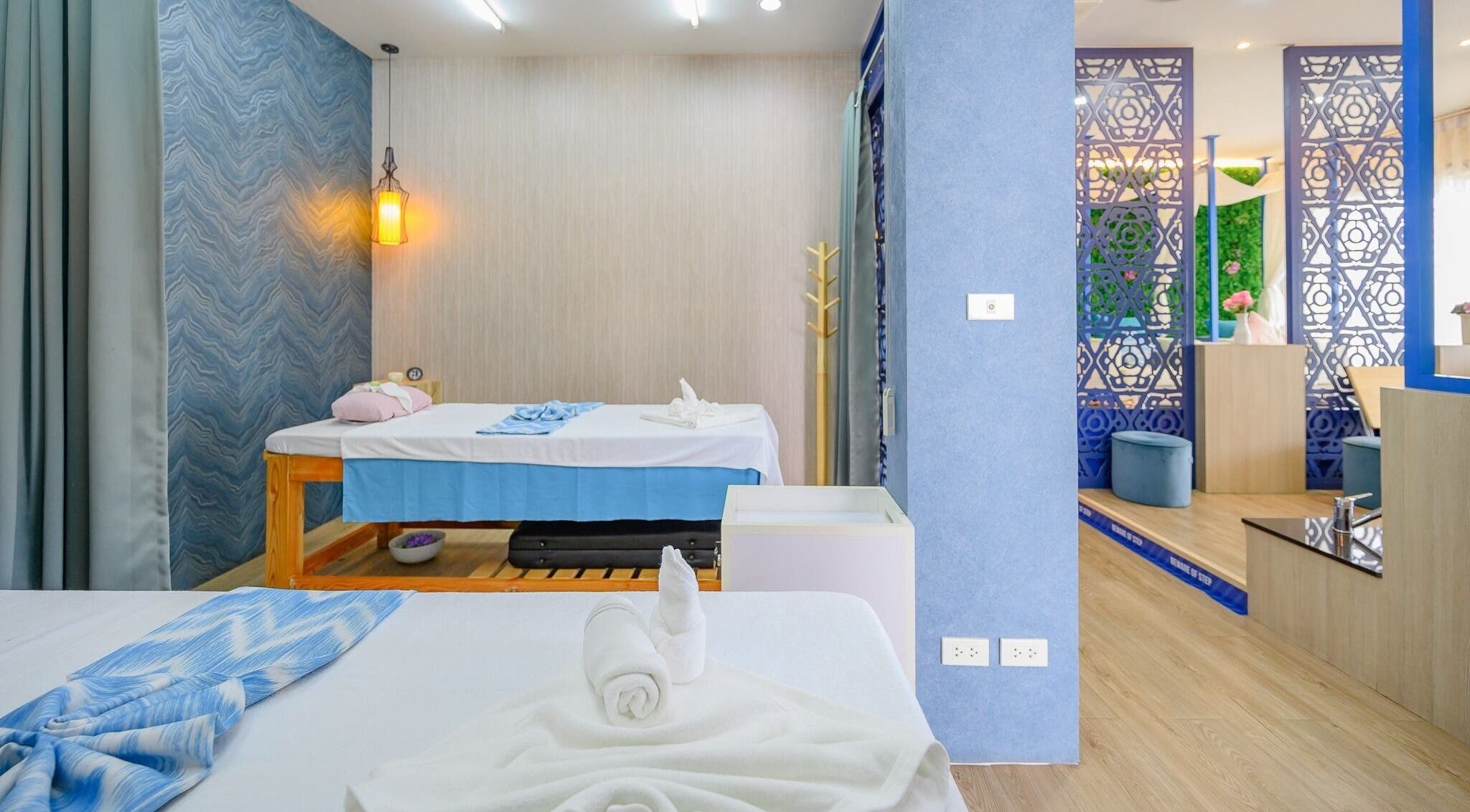 Relaxing massage room at Apsara Spa, Tambon Choeng Thale, Phuket, TH showcasing luxurious treatment beds.