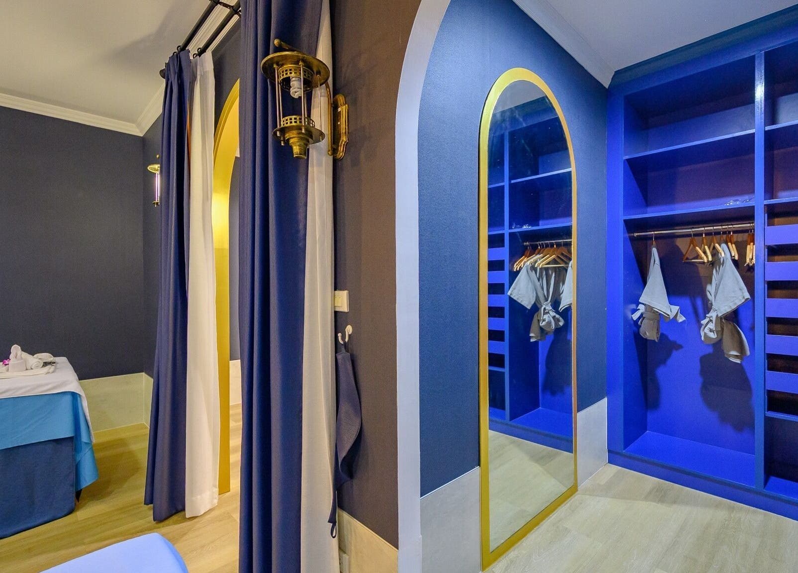 Elegant blue therapy room at Apsara Spa, Tambon Choeng Thale, Phuket, TH, showcasing soothing ambiance.