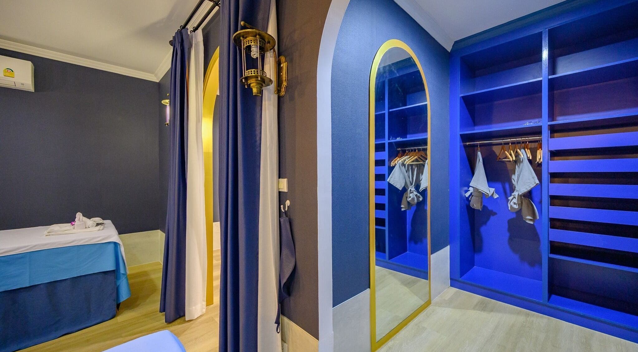 Elegant blue therapy room at Apsara Spa, Tambon Choeng Thale, Phuket, TH, showcasing soothing ambiance.