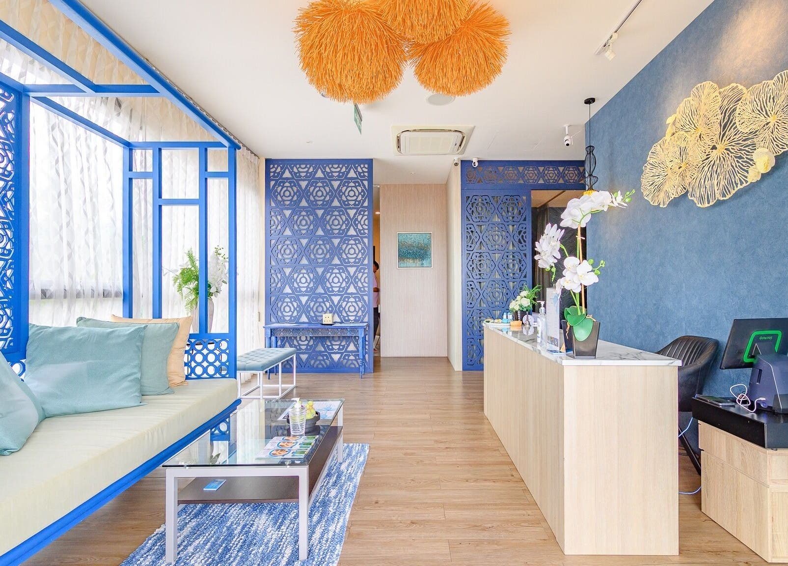 Elegant reception area at Apsara Spa, Tambon Choeng Thale, Phuket, TH with blue decor and plush seating.