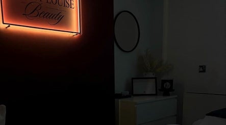 Warm-lit sign of Penny Louise Beauty in Horsforth, England, GB, creating a tranquil atmosphere.