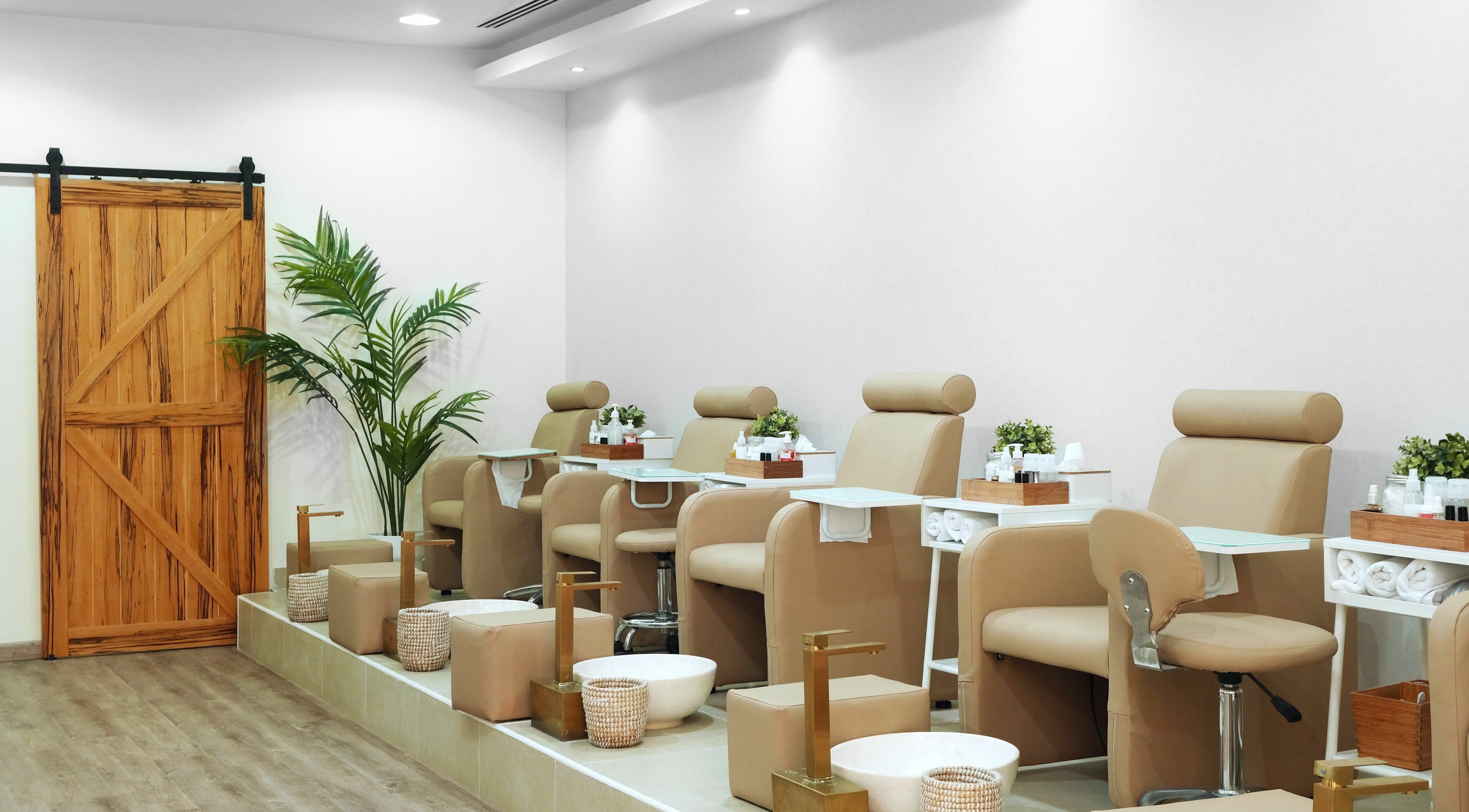 Luxurious pedicure area at Sky Beauty Salon, Dubai, AE with comfortable seating and modern decor.