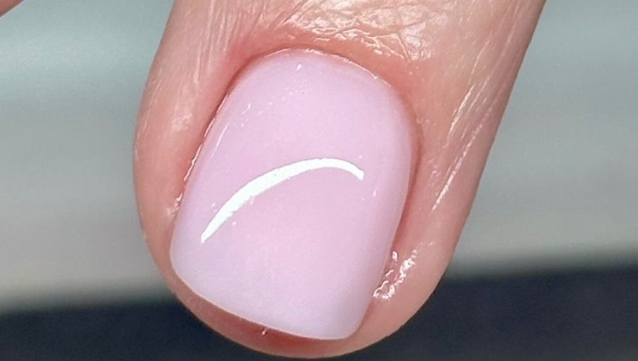 Close-up of glossy, manicured nail at Tek Nails & Training, Halfway, England, GB.