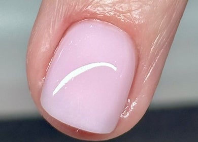 Close-up of glossy, manicured nail at Tek Nails & Training, Halfway, England, GB.