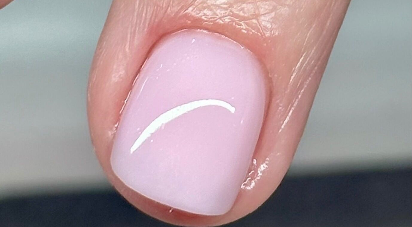 Close-up of glossy, manicured nail at Tek Nails & Training, Halfway, England, GB.