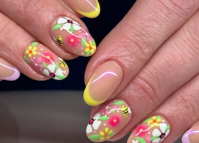 Intricate floral nail art at Tek Nails Sheffield in Halfway, England, GB. Vibrant colors and delicate design.
