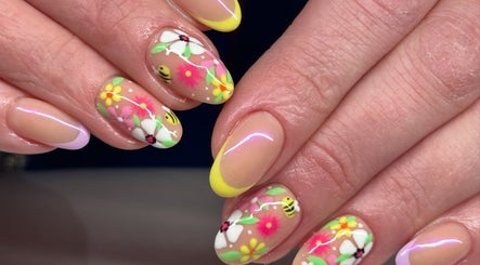 Intricate floral nail art at Tek Nails Sheffield in Halfway, England, GB. Vibrant colors and delicate design.
