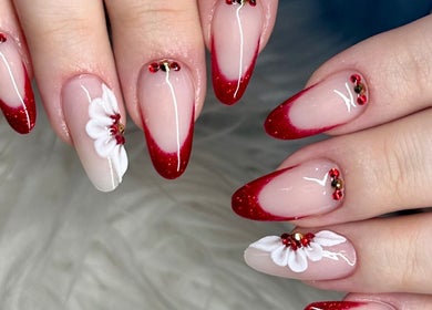 Stunning red tipped floral manicure at Tek Nails Sheffield, located in Halfway, England, GB.