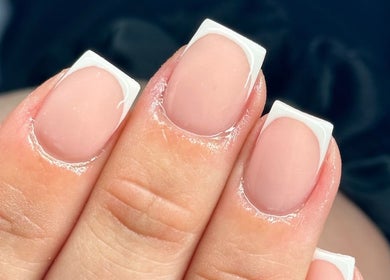 Elegant French manicure at Tek Nails Sheffield in Halfway, England, GB showcasing classic style.