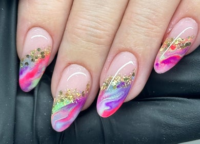 Vibrant rainbow nails with glitter detail at Tek Nails Sheffield, Halfway, England, GB.