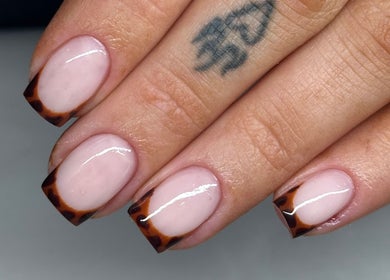 Stylish tortoiseshell French manicure at Tek Nails Sheffield, Halfway, England, GB. Perfectly crafted nail art.