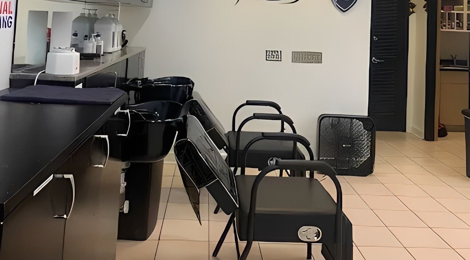 M Hair Studios in Moreno Valley, California, showcases sleek salon chairs and washing stations.