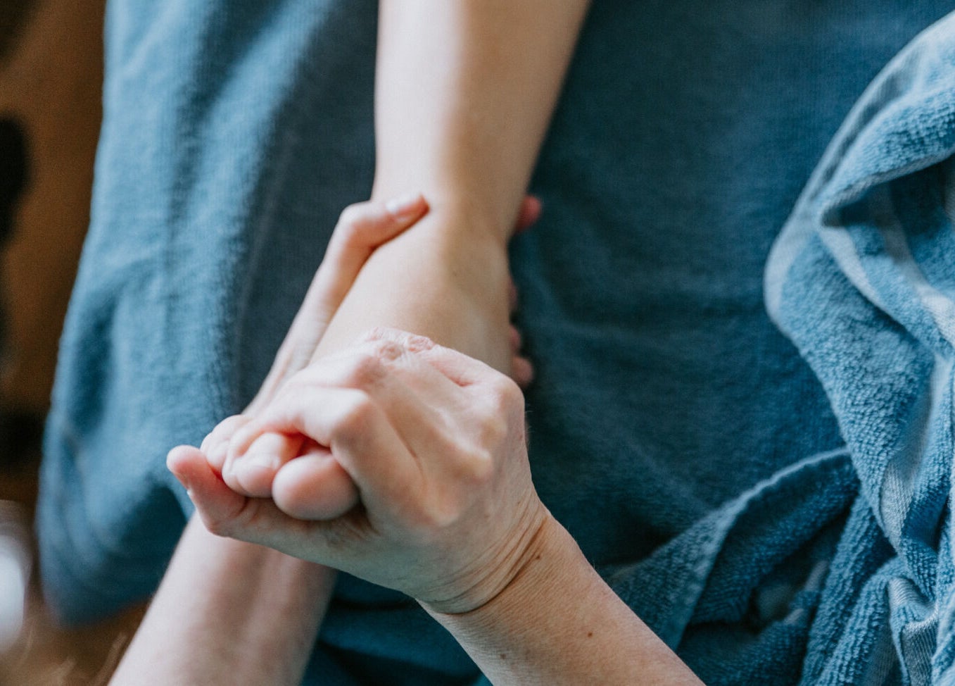 Foot reflexology session at Sole Divine Reflexology+ in Brandon, Manitoba, CA, enhancing relaxation and wellness.