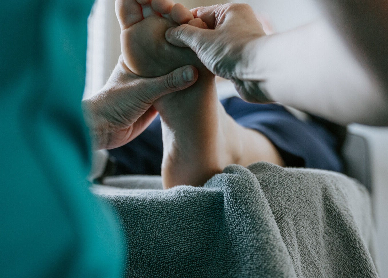 Reflexology session at Sole Divine Reflexology+, Brandon, Manitoba, CA, focusing on foot massage for relaxation.