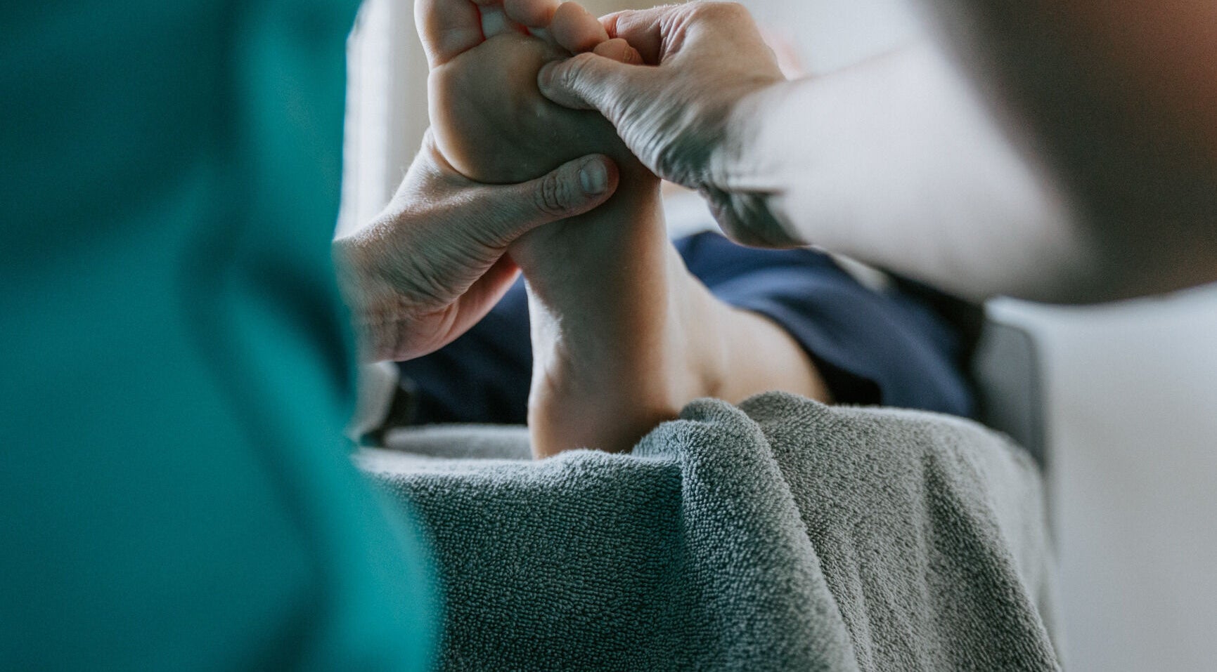 Reflexology session at Sole Divine Reflexology+, Brandon, Manitoba, CA, focusing on foot massage for relaxation.
