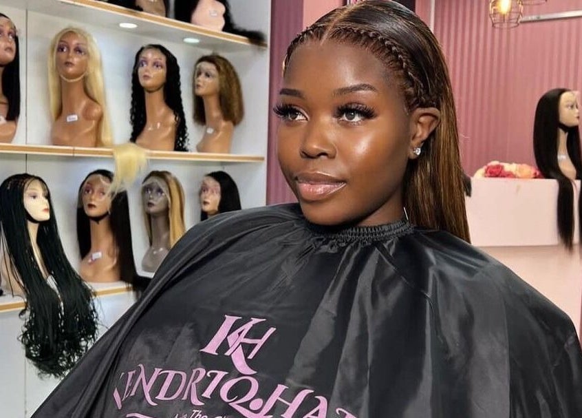 Client adorned with sleek style at KendriQ Hair Salon Fourways, Fourways, Sandton, Gauteng, ZA.