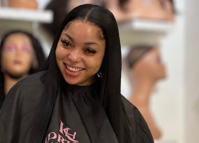 Happy client at KendriQ Hair Salon Fourways, located in Fourways, Sandton, Gauteng, ZA, showcasing beautiful hairstyle.