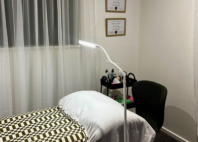 Treatment room at Beauty By Stella Love, Christchurch, Canterbury Region, NZ, featuring a cozy bed and ambient lighting.