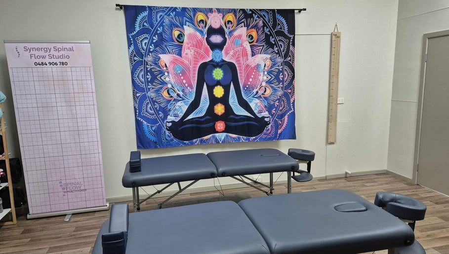 Synergy Spinal Flow Studio therapy room with chakra art, Mareeba, Queensland, AU.