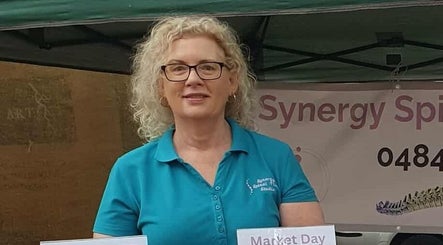 Friendly staff at Synergy Spinal Flow Studio booth in Mareeba, Queensland, AU.
